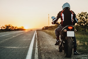person on a motorcycle on the side of the road